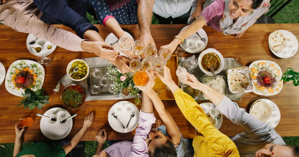Big Indian Family Lunch Table: Top Down Elevated View at a Family and Friends Celebrating Outside