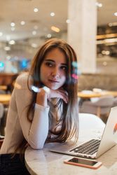Female student works on project in a restaurant