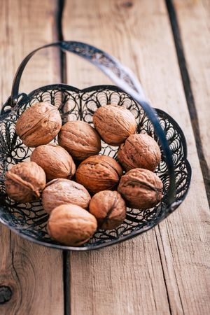 Ornamental basket with walnuts