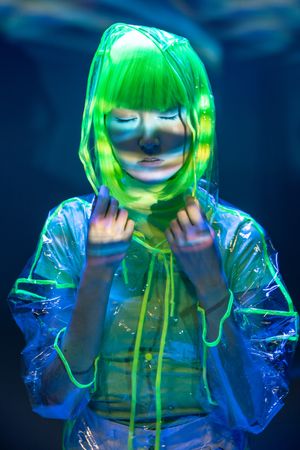 Asian woman posing in fluorescent light