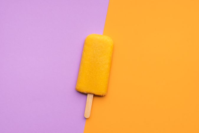 Orange popsicle ice cream vertical