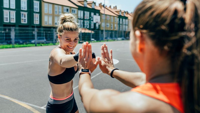 Sportswoman training boxing with her trainer