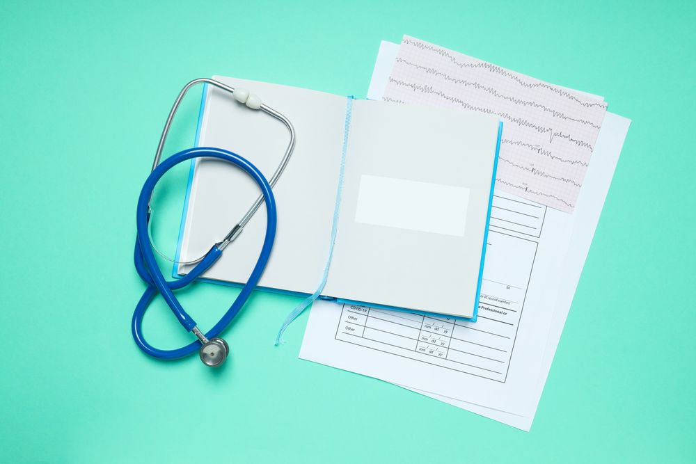 Concept of medical education and books, top view