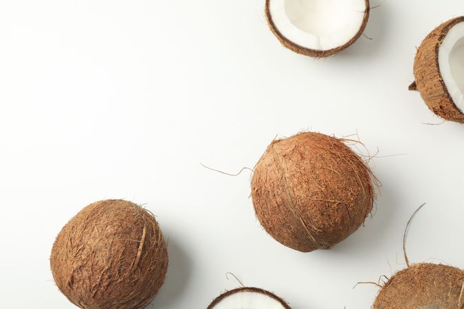 Flat lay with coconut on plain background, top view