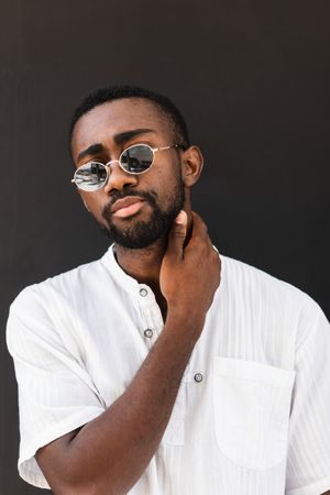 Black man in trendy clothes in city