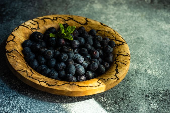 Bowl of organic blueberry fruits