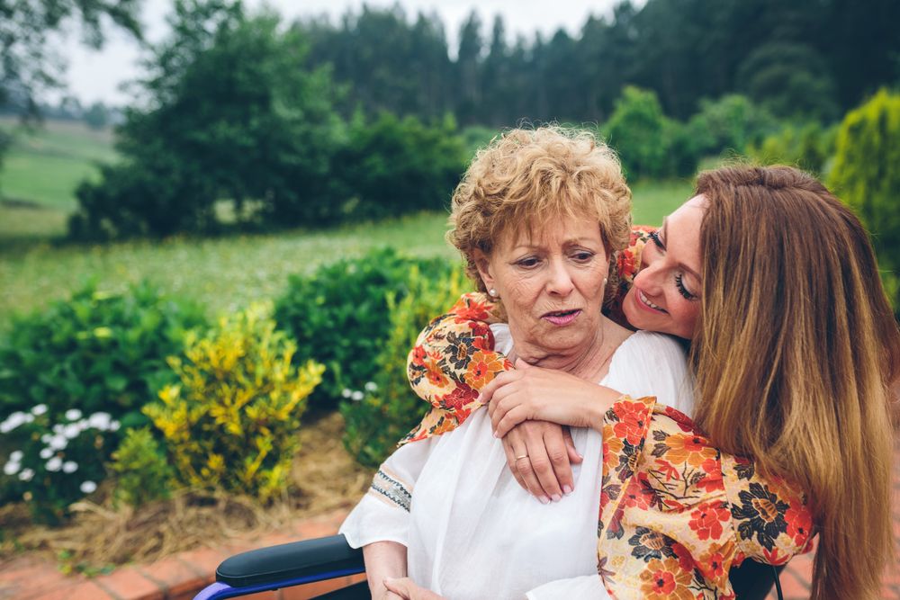 Dissatisfied woman in a wheelchair with her daughter