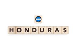 Wooden blocks bearing the name and flag of Honduras. Honduran and Caribbean Culture, national identity, travel, and geography in a copy space design.