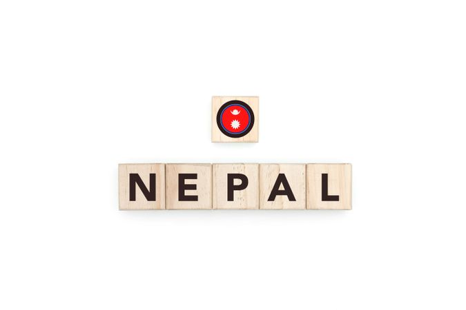 Wooden blocks bearing the name and flag of Nepal.