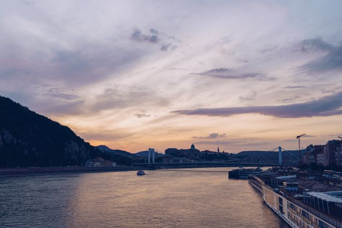 River landscape under gray cloudy sky in city