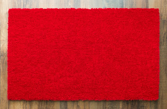 Blank Red Welcome Mat On Wood Floor Background Ready For Your Own Text