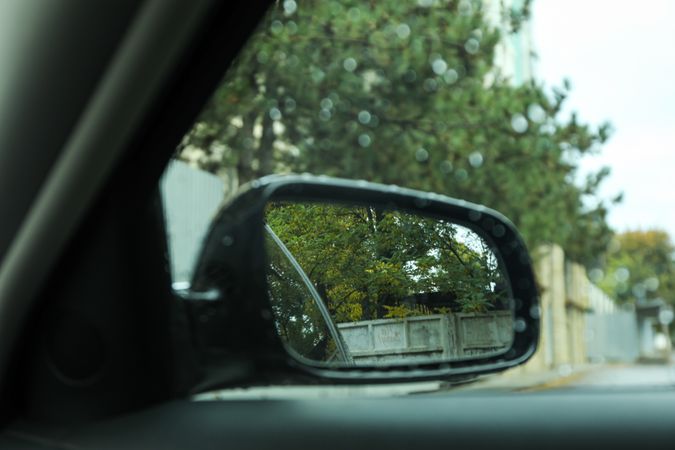 Rearview mirror of a car in rainy weather
