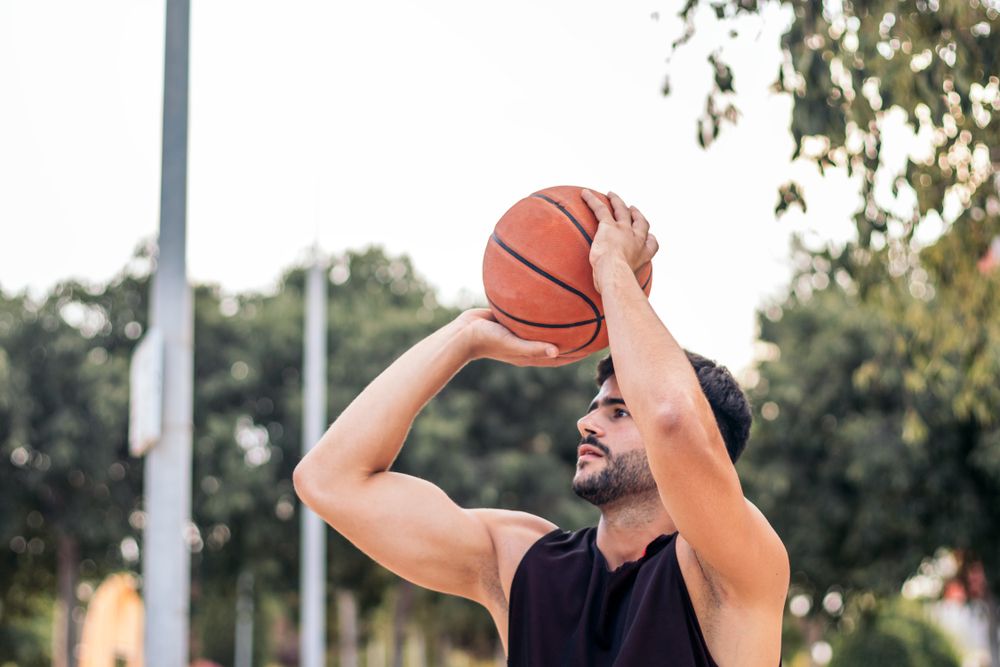 Game On: Young Man Ready to Shoot Hoops