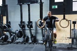 Man exercising on air bike