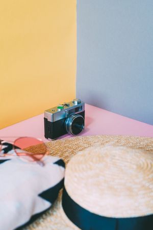 Summer trendy sunglasses, towel, hat and camera