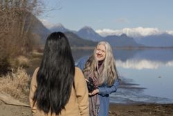 Laughing woman talking with her model