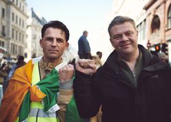 London, England, United Kingdom - March 19 2022: Two men making raised fist at anti-racism rally