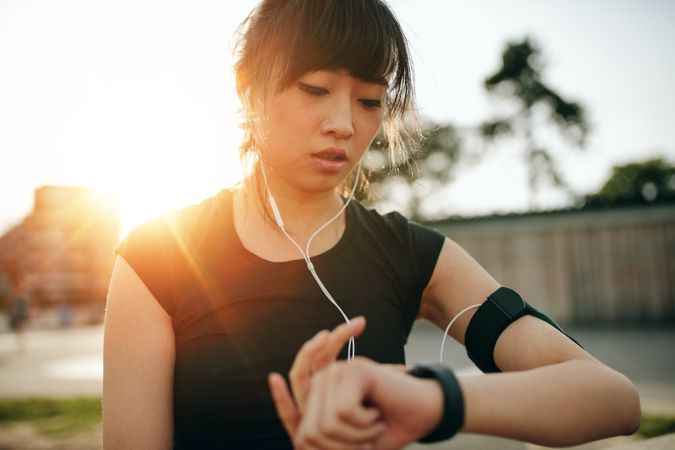 Fitness female monitoring her progress on smartwatch