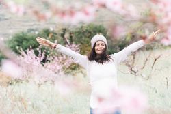 Happy woman in spring countryside