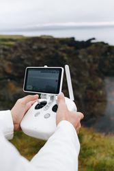 Man with remote control in nature