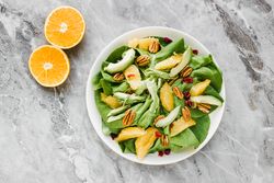 Served avocado and orange with pecan