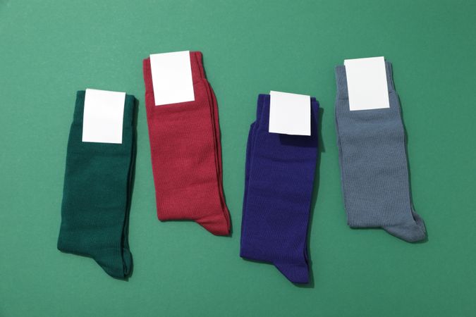 Multicolored high socks on a green background.