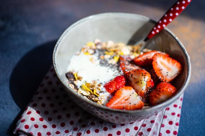 Healthy morning breakfast bowl with oatmeal and strawberry