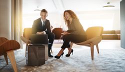 Man and woman in business casual working together