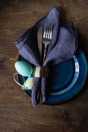 Easter table setting with nave plate and decorative egg