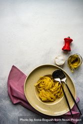 Plain pasta with oil & salt on counter with copy space 5qkqLj