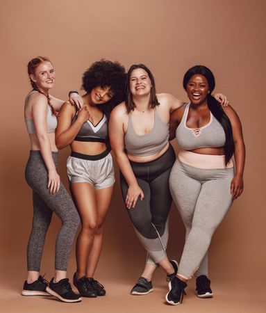 Healthy group of females wearing leggings, shorts and sport bras