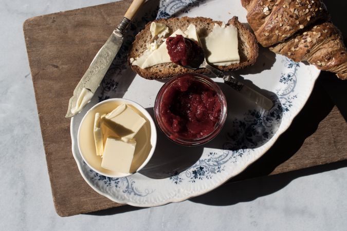 Served breakfast meal with sandwich and jam