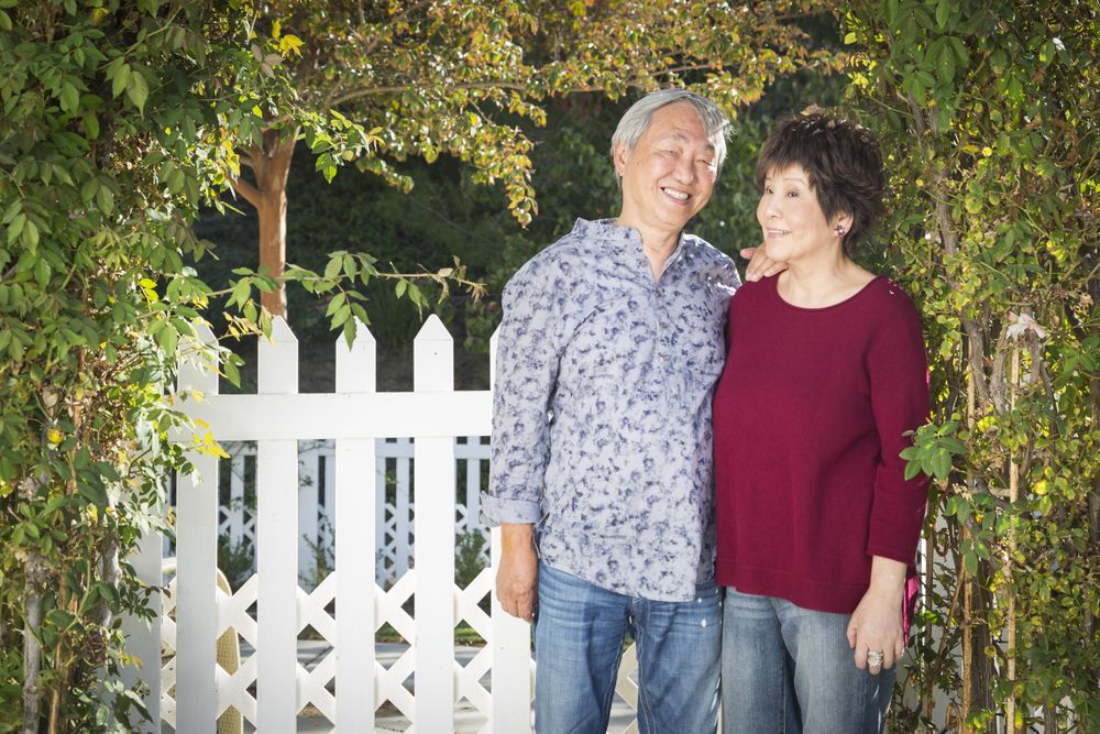 Happy Chinese Couple Enjoying Their House