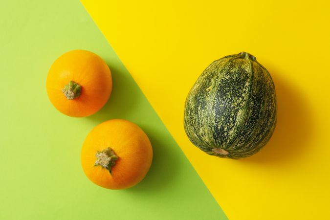 Round zucchini on two tone background, top view