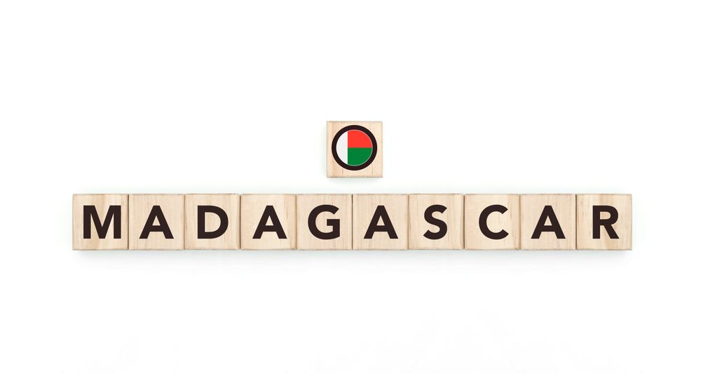 Wooden blocks bearing the name and flag of Madagascar. Malagasy and African Culture, national identity, travel, and geography in a copy space design.
