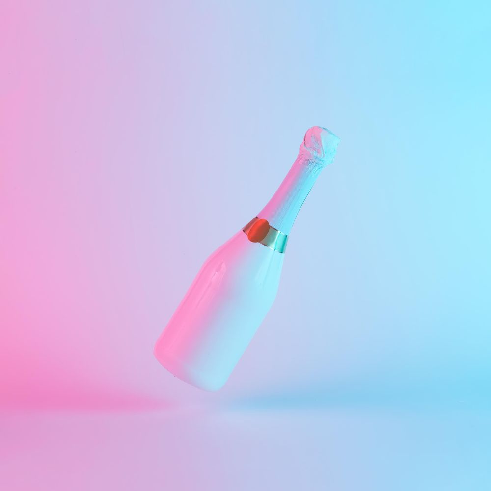 Champagne bottle with colorful ultraviolet holographic neon lights