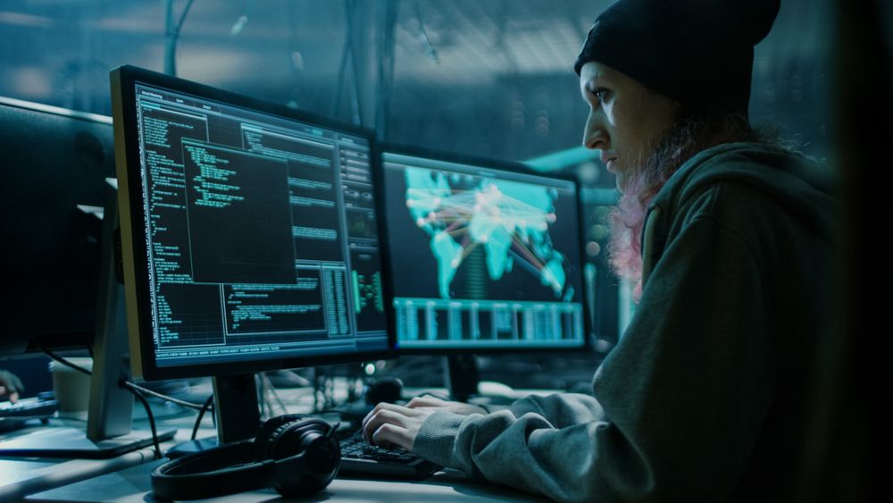 Nonconformist Hacker Using her Computer to Organize Malware Attack on Global Scale.