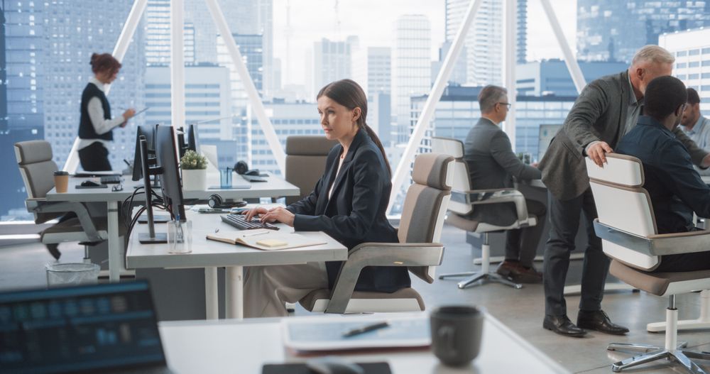 In Big Corporate Skyscraper Office: Female Business Manager Using Computer