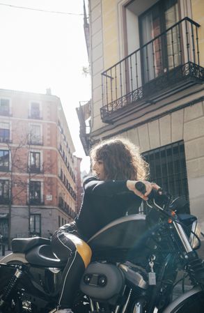 Young woman in custom motorbike