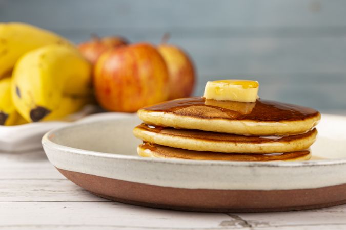 Delicious pancakes with butter and honey.