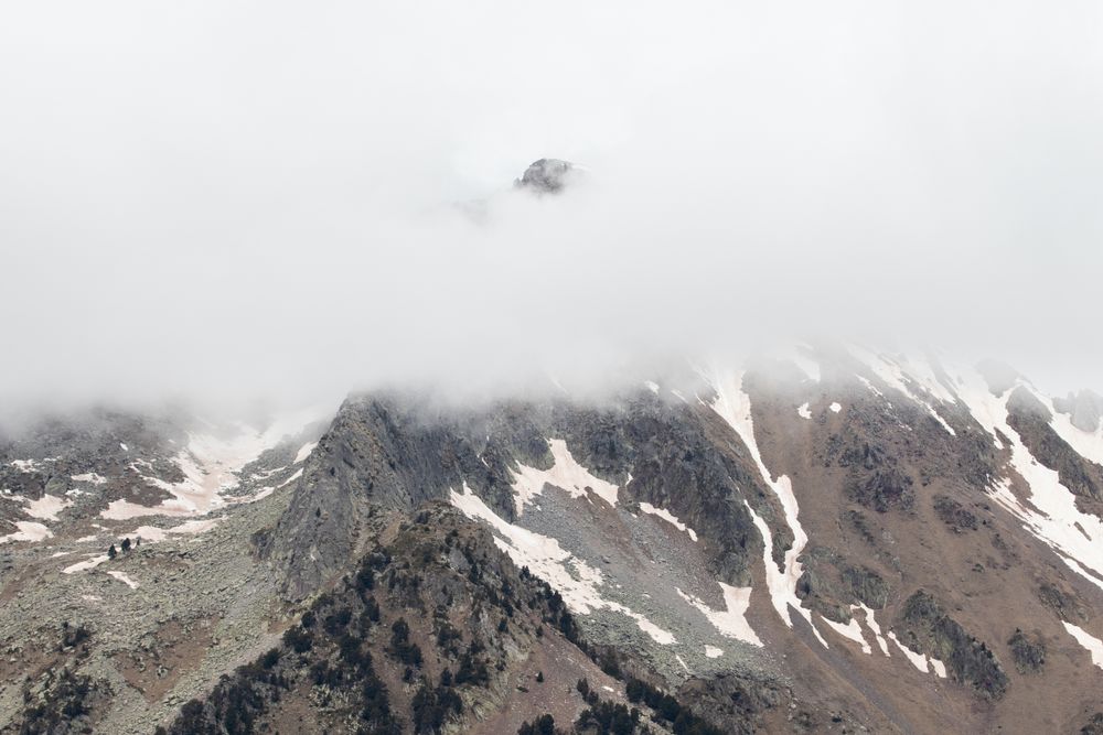 Rocky mountains covered with snow on sunny day