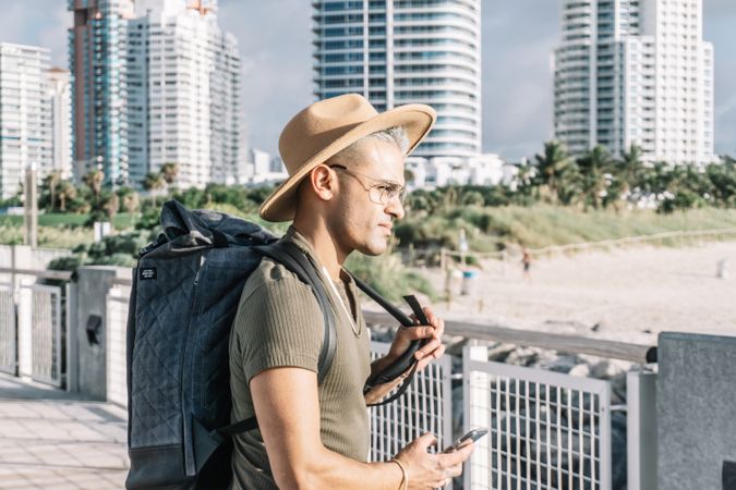 Profile, young man with a backpack