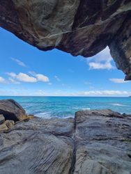 View of the water seen from within a cave