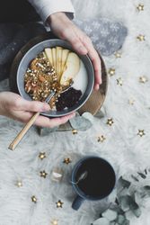 Faceless woman taking healthy breakfast bowl