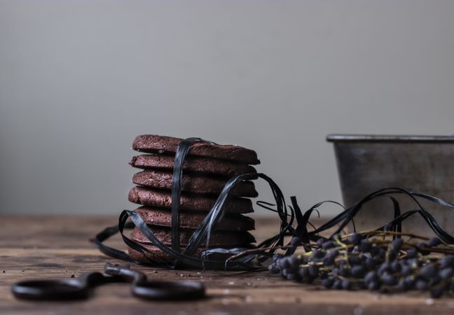 Stack of chocolate cookies tied with black ribbon