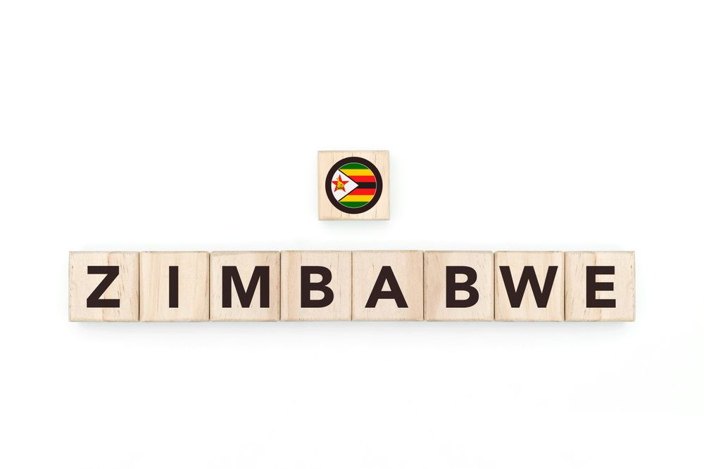 Wooden blocks bearing the name and flag of Zimbabwe. Zimbabwean and South African Culture, national identity, travel, and geography in a copy space design.