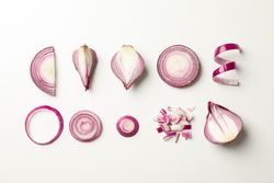 Flat lay composition with red onion on neutral background