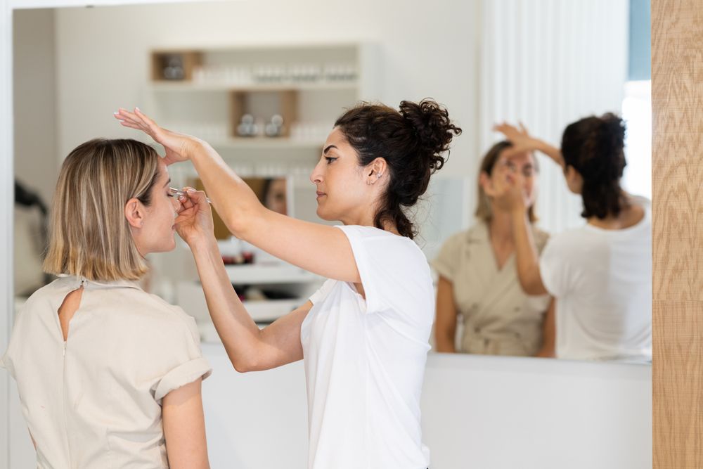 Woman having her make up applied in spa