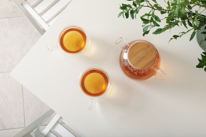 kitchen table with tea and plant