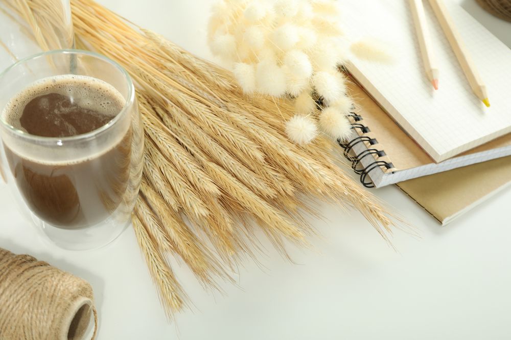 Close up of yarn, notebook and dried willows